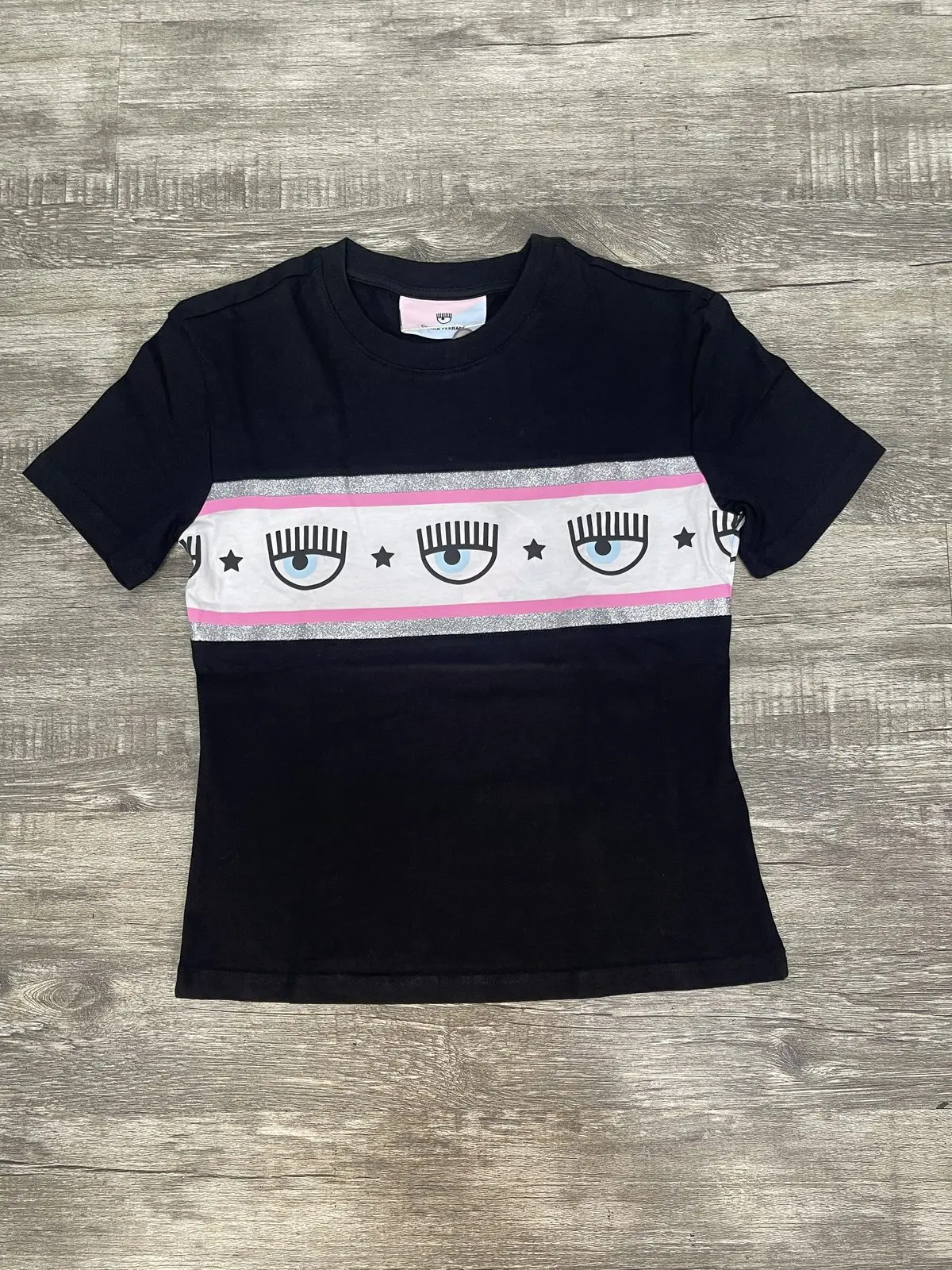 Polera chiara negra franja rosa